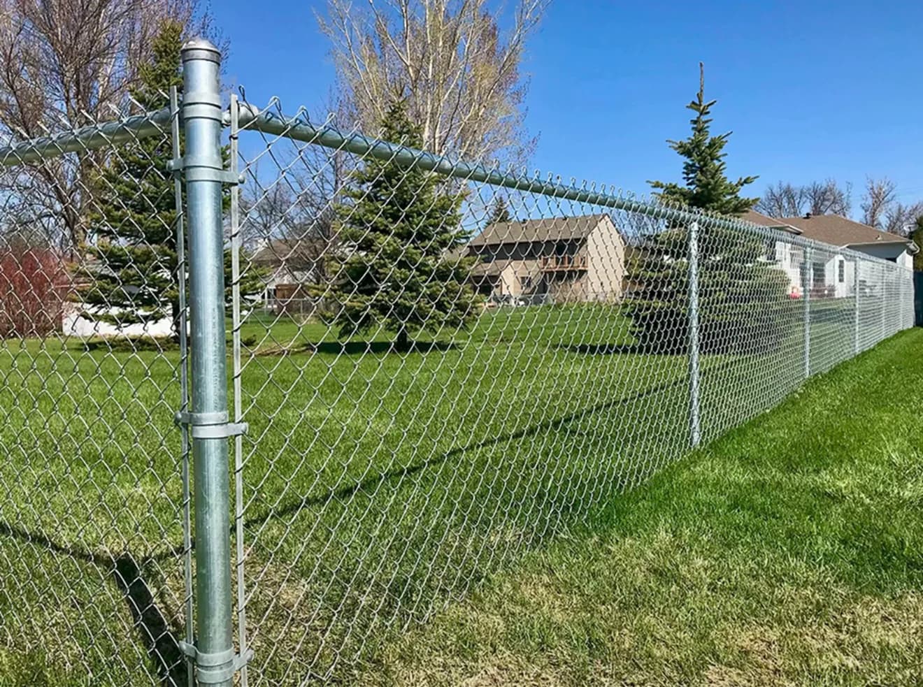 Galvanized chain link fence install by A Class Fencing in Calgary